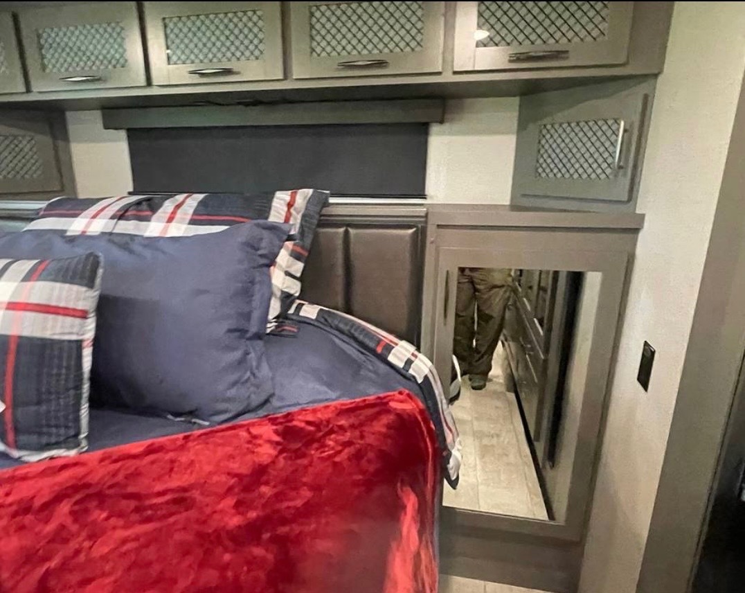 Bedroom view showing built-in storage and fireplace area