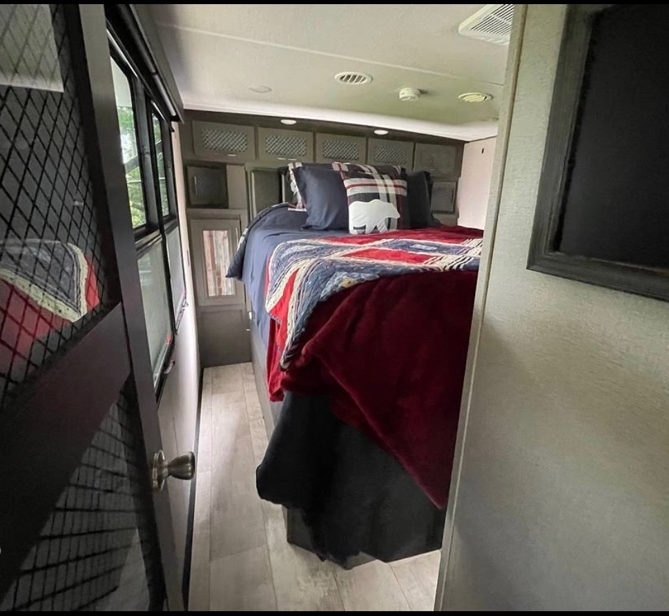 Master bedroom with built-in storage and natural lighting