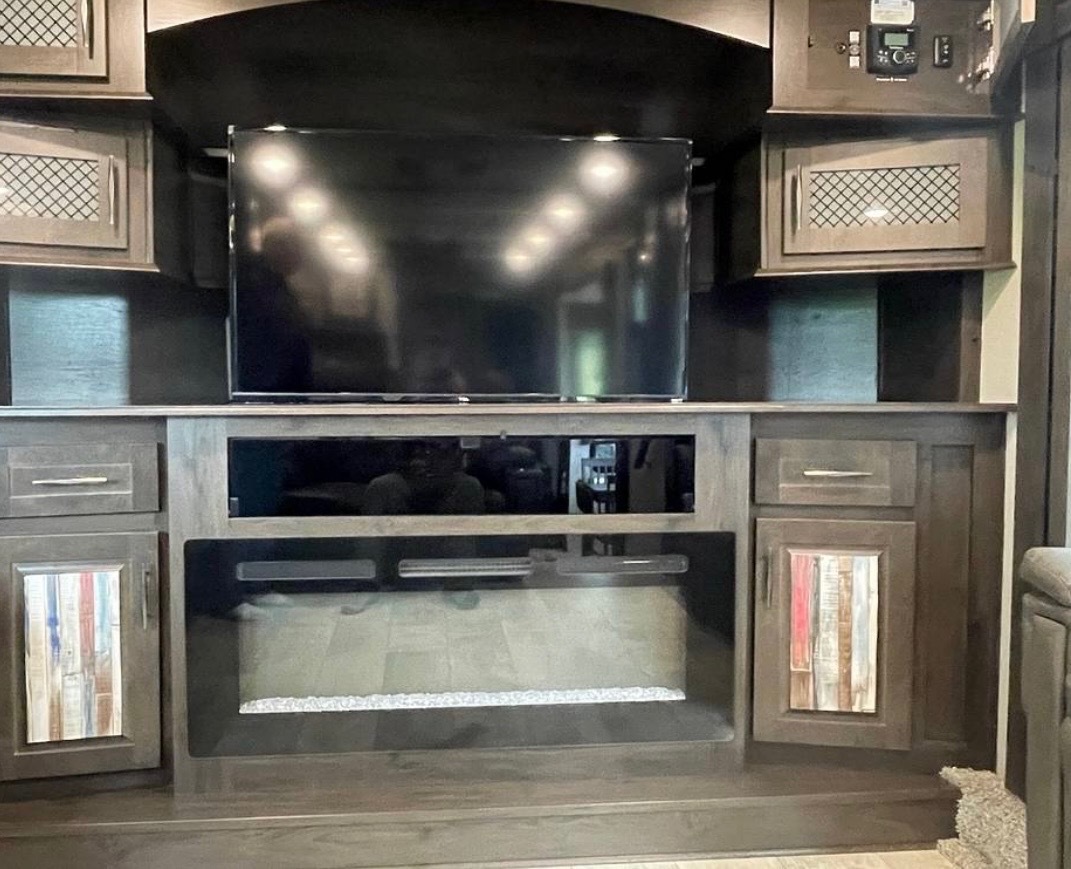 Entertainment center with fireplace, TV mount, and custom cabinetry