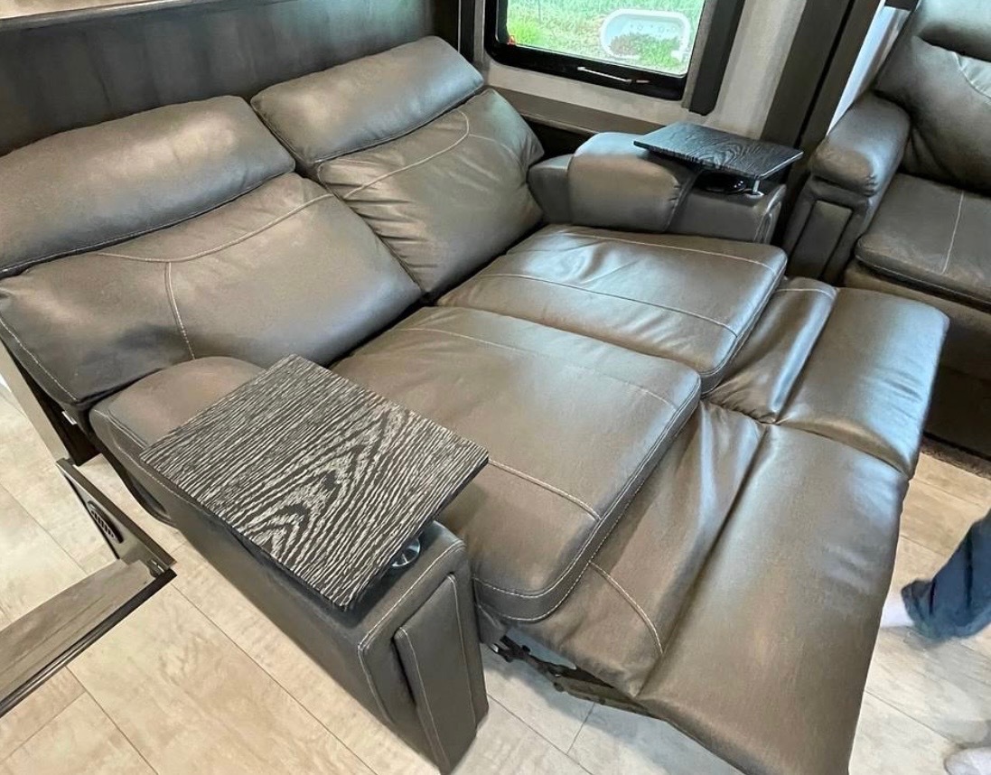 Premium leather theater seating with cup holders and reclining features