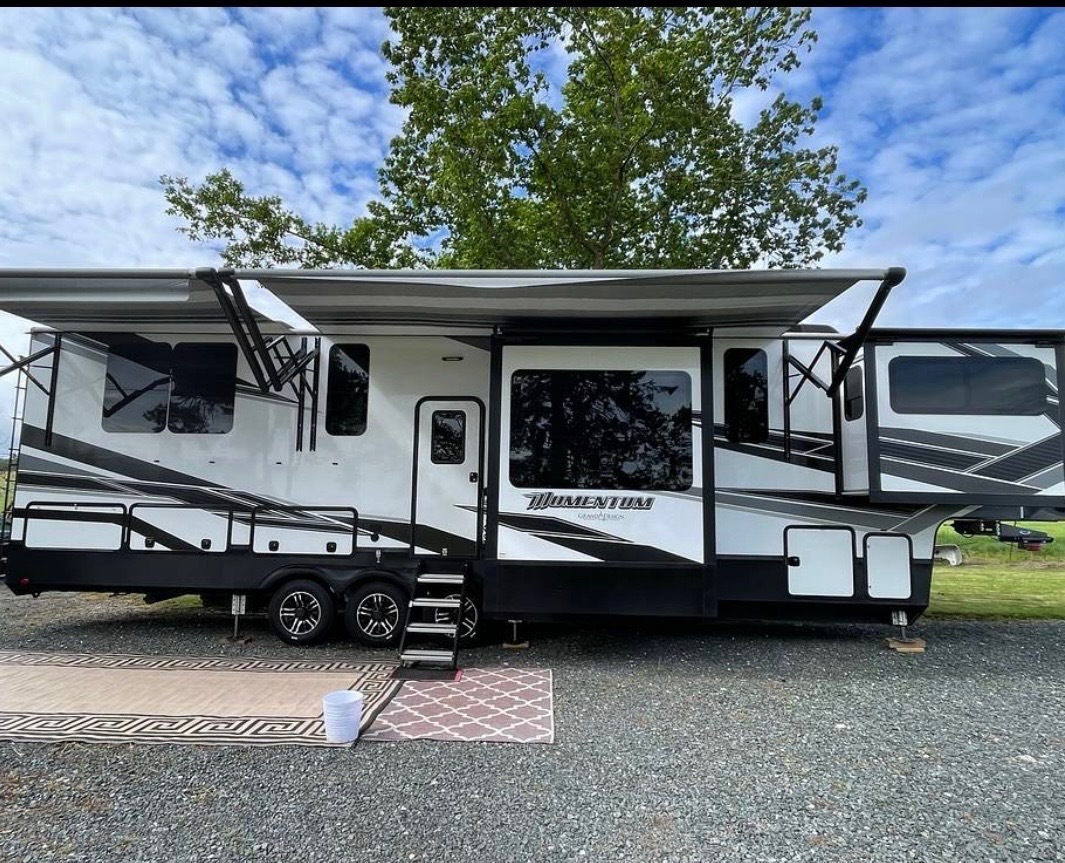 Exterior view with extended awnings and outdoor setup